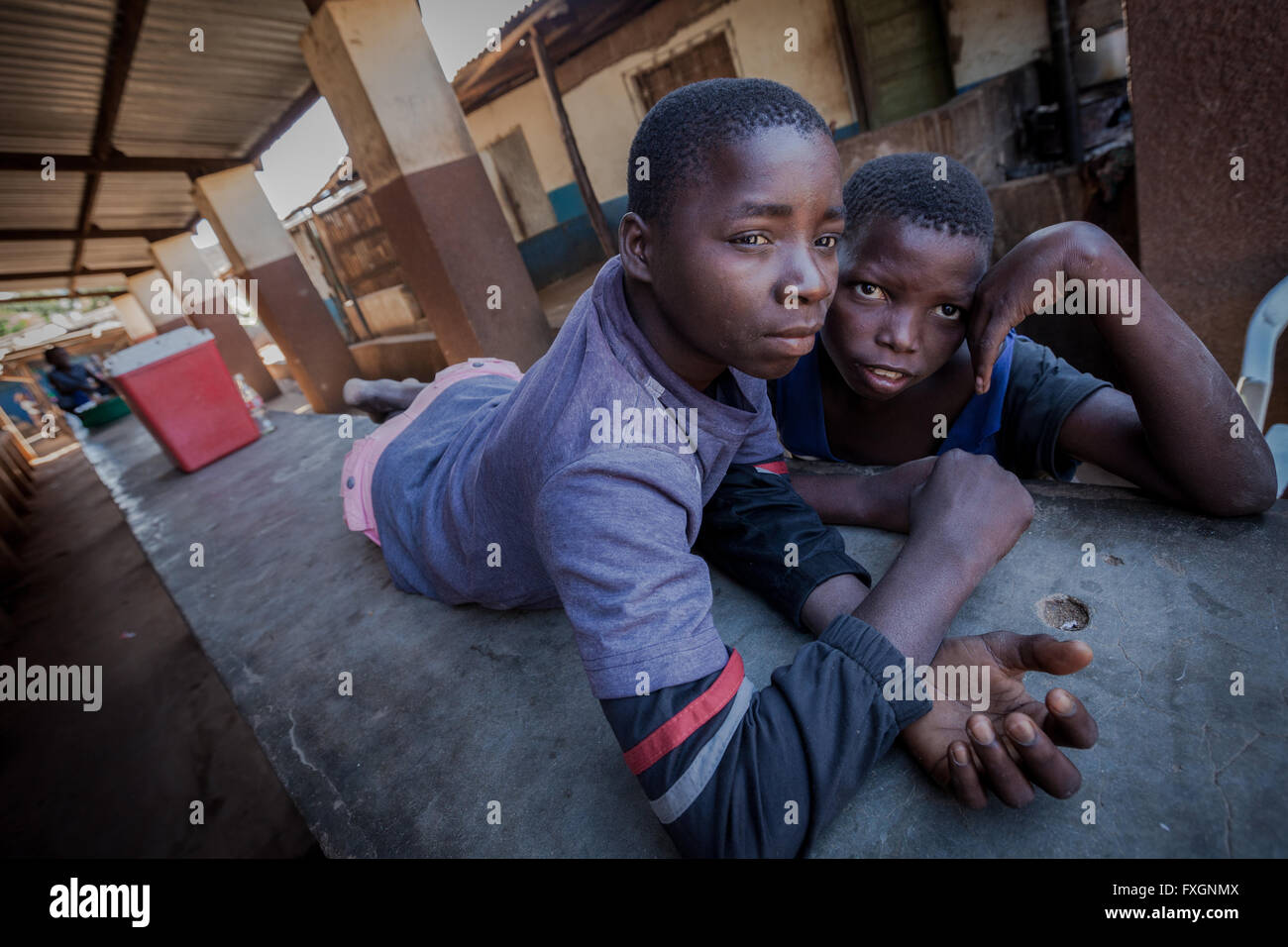 Mozambique,Africa, poor boys in fruit market. Stock Photo