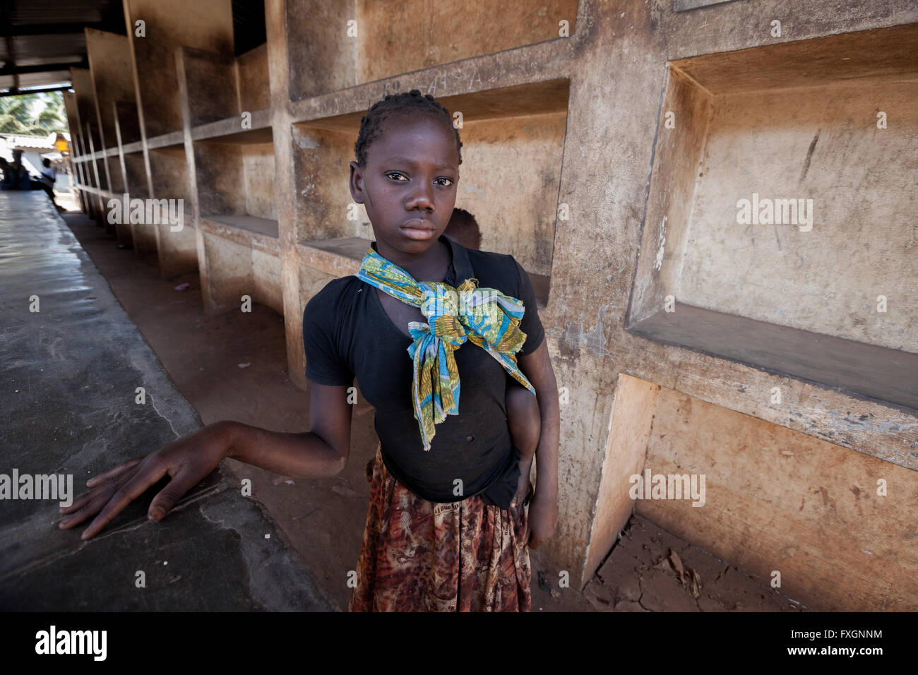 Mozambique,Africa, poor girl in fruit market. Stock Photo