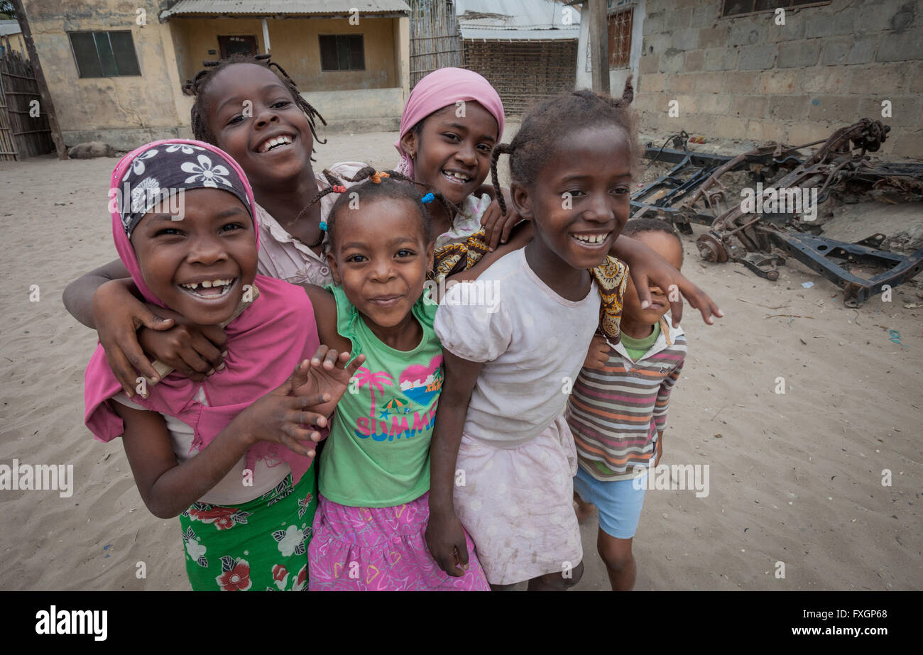 Mozambique, girls friendship smiling and posing in a hug. Stock Photo