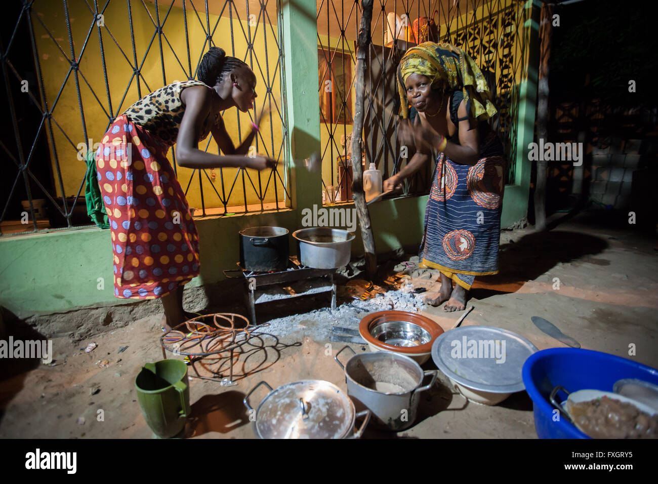 Mozambique, women are cooking traditional cousin. Stock Photo