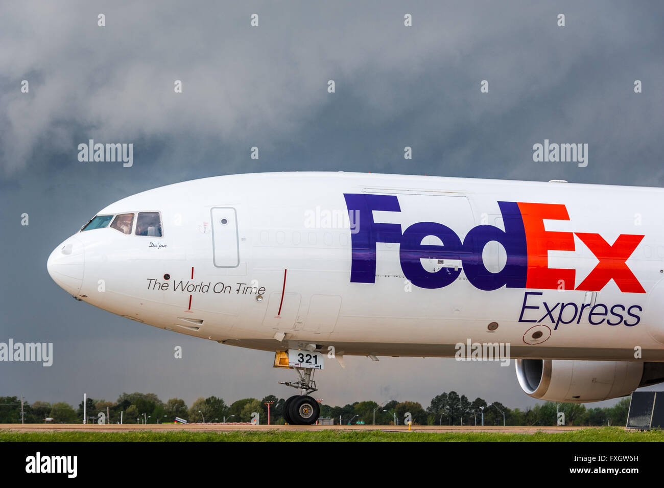 FedEx Express jet against a background of incoming weather at Memphis International Airport, the delivery leaders global hub. Stock Photo