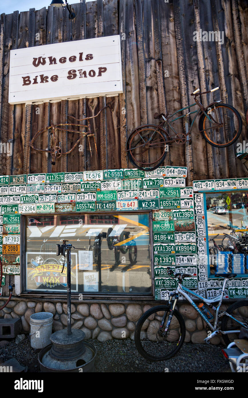 Wheels Bike shop decorated with old license plates and rusted bicycles