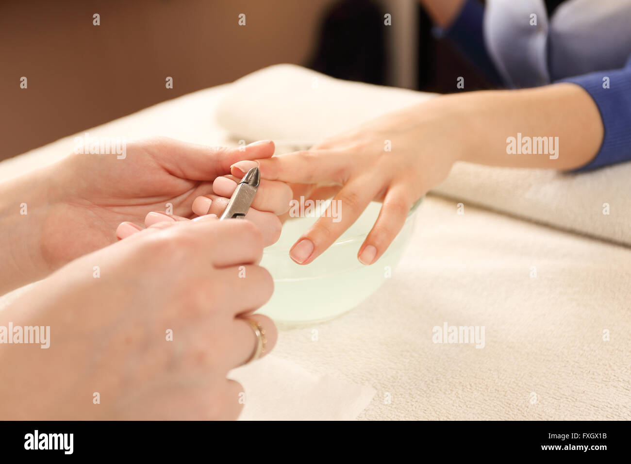 Close up process of manicure at beauty salon Stock Photo