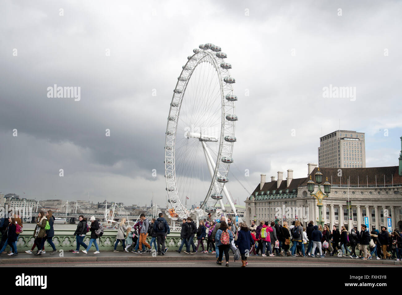 London. School holidays. Students walk across Westminster Bridge with