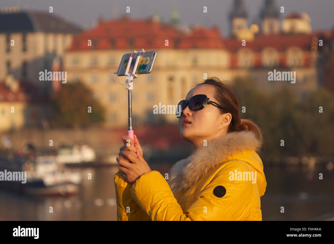 Oriental tourist taking a selfie on Charles Bridge, Prague Stock Photo