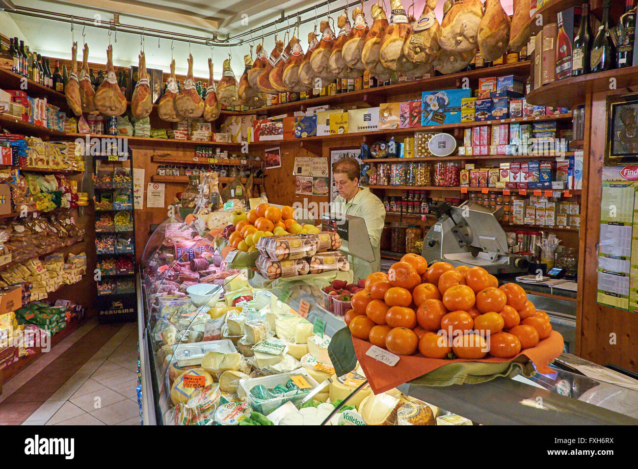 Forno Alimentari G. Giurlani. Interior of Italian shop showing hams, cheeses and a range of other goods. Stock Photo
