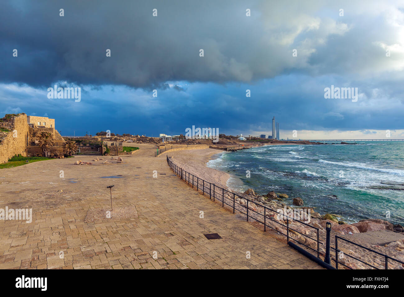 Sea Coast and Ruins of Caesarea Maritima before Sunset, Israel Stock Photo