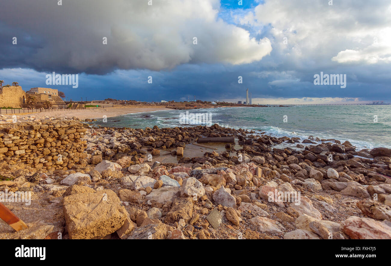 Sea Coast and Ruins of Caesarea Maritima before Sunset, Israel Stock Photo