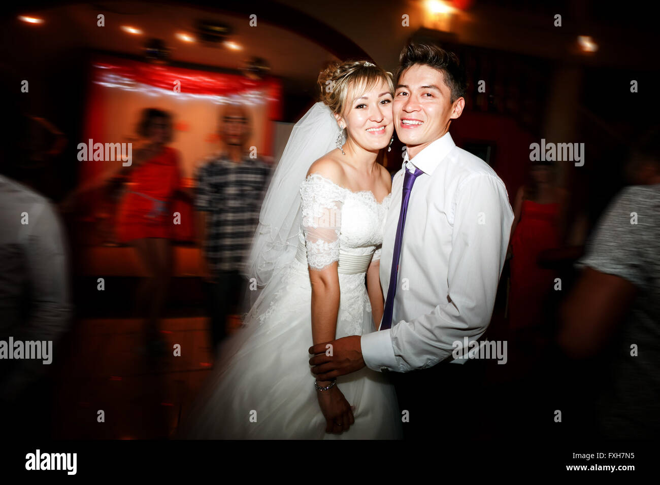 Bride And Groom Dancing Motion On Dance Floor During Wedding Stock
