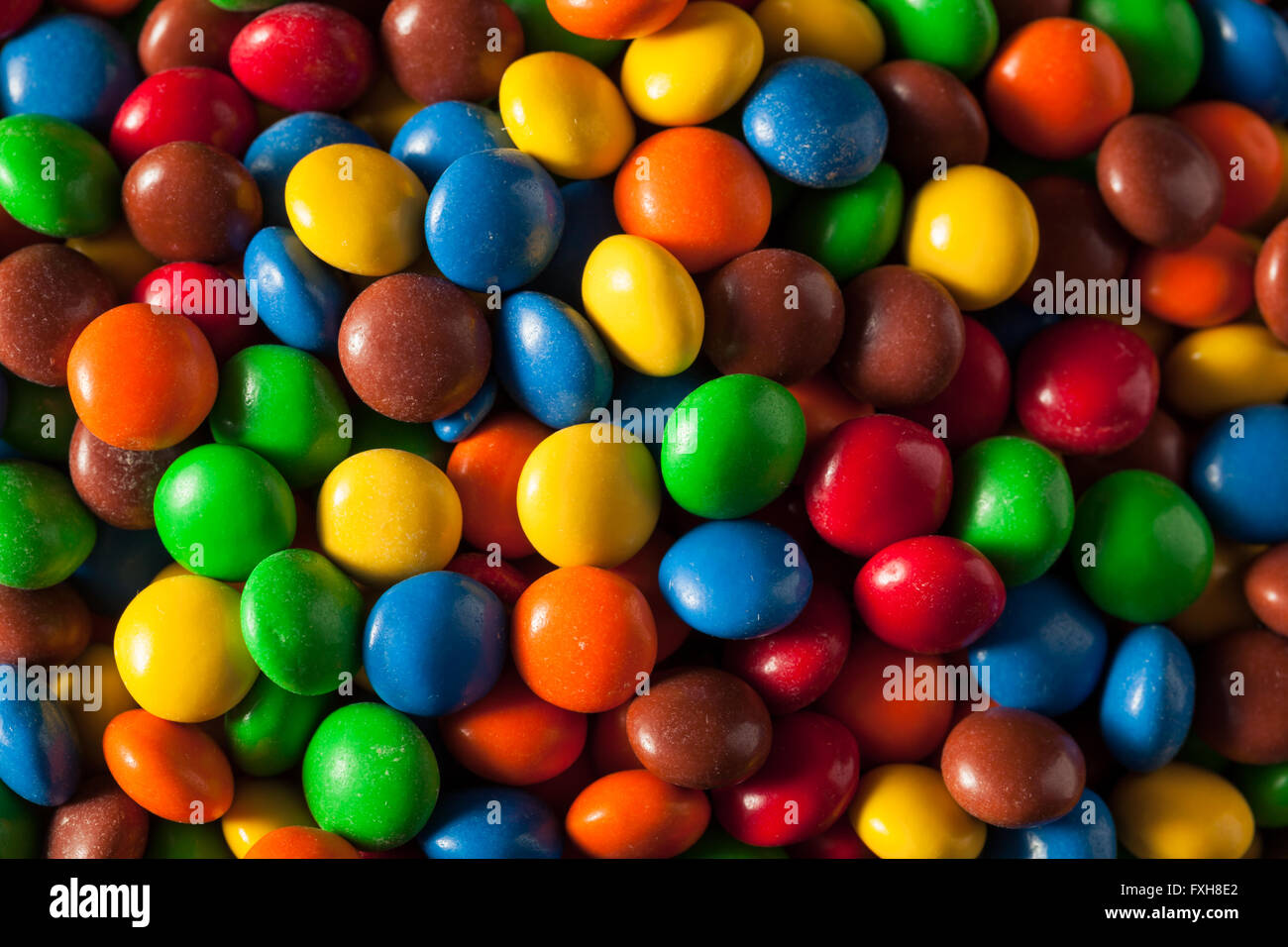 Rainbow Colorful Candy Coated Chocolate Pieces in a Bowl Stock Photo - Alamy