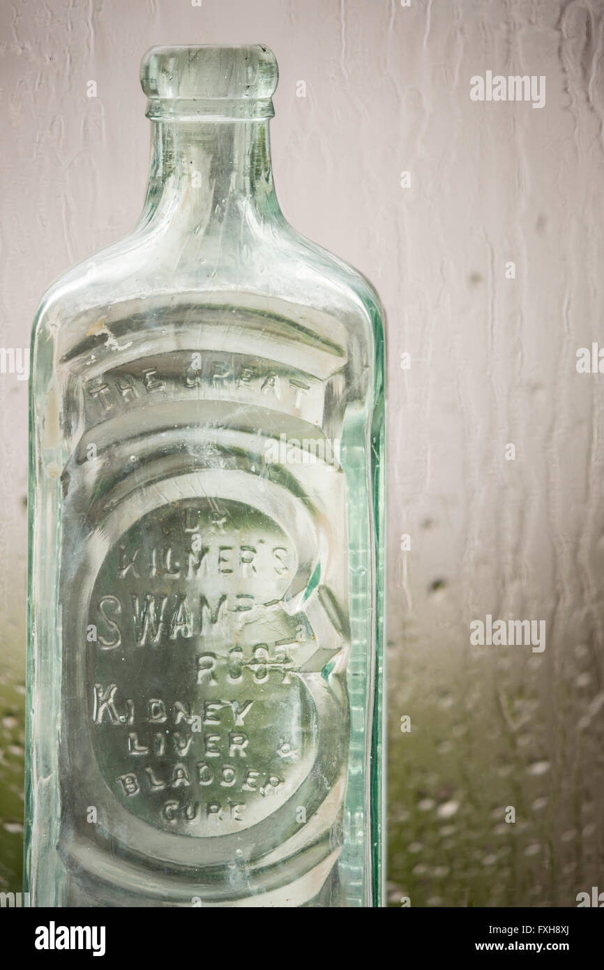 Old medicine bottles in front of a rainy window Stock Photo - Alamy