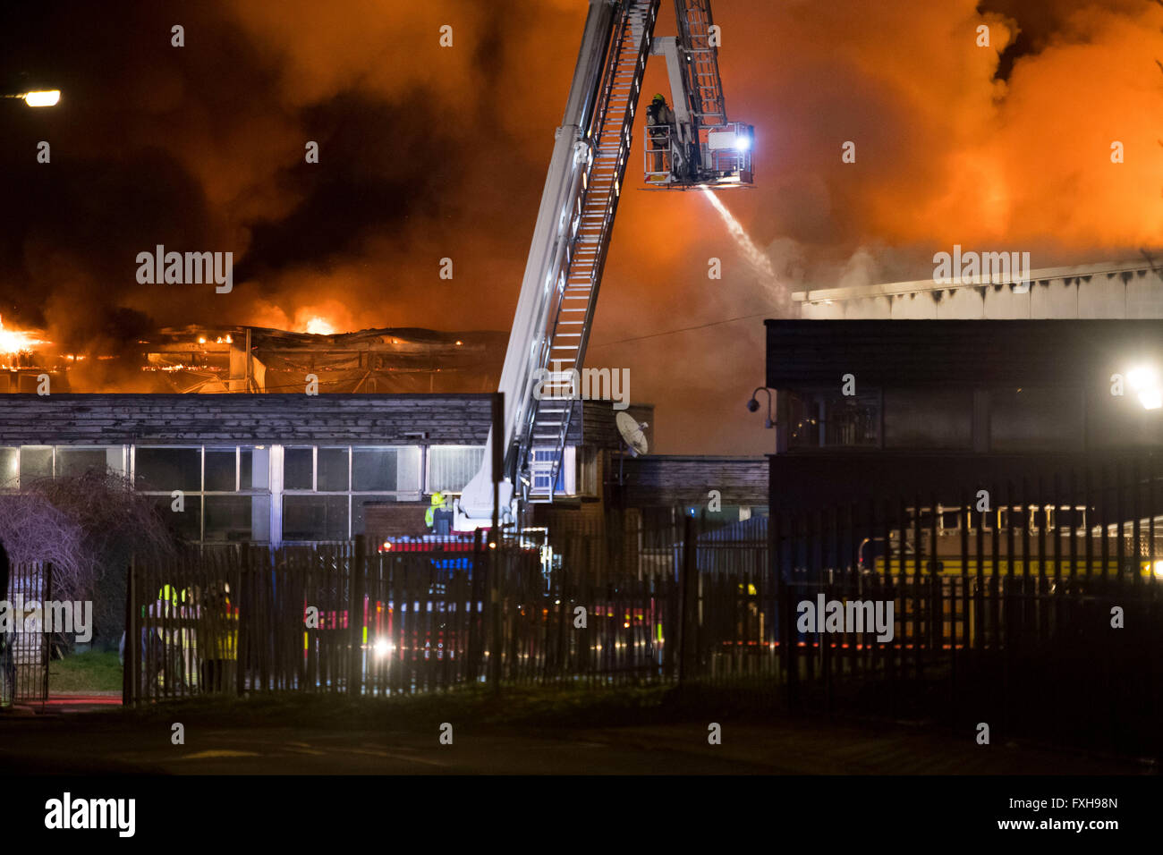 Firefighters tackle a raging burning fire at Glyn Derw High School in Cardiff. Firefighters claimed the fire was arson. Stock Photo
