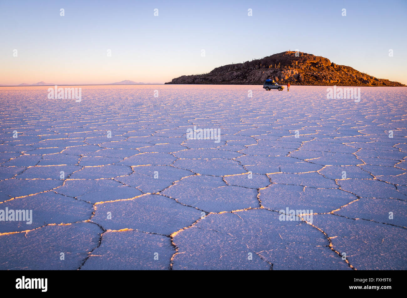 Salar Uyuni, BOLIVIA in September 2015: The sun rises over worlds largest salt lake Salar de Uyuni. Southwestern Bolivia is well Stock Photo