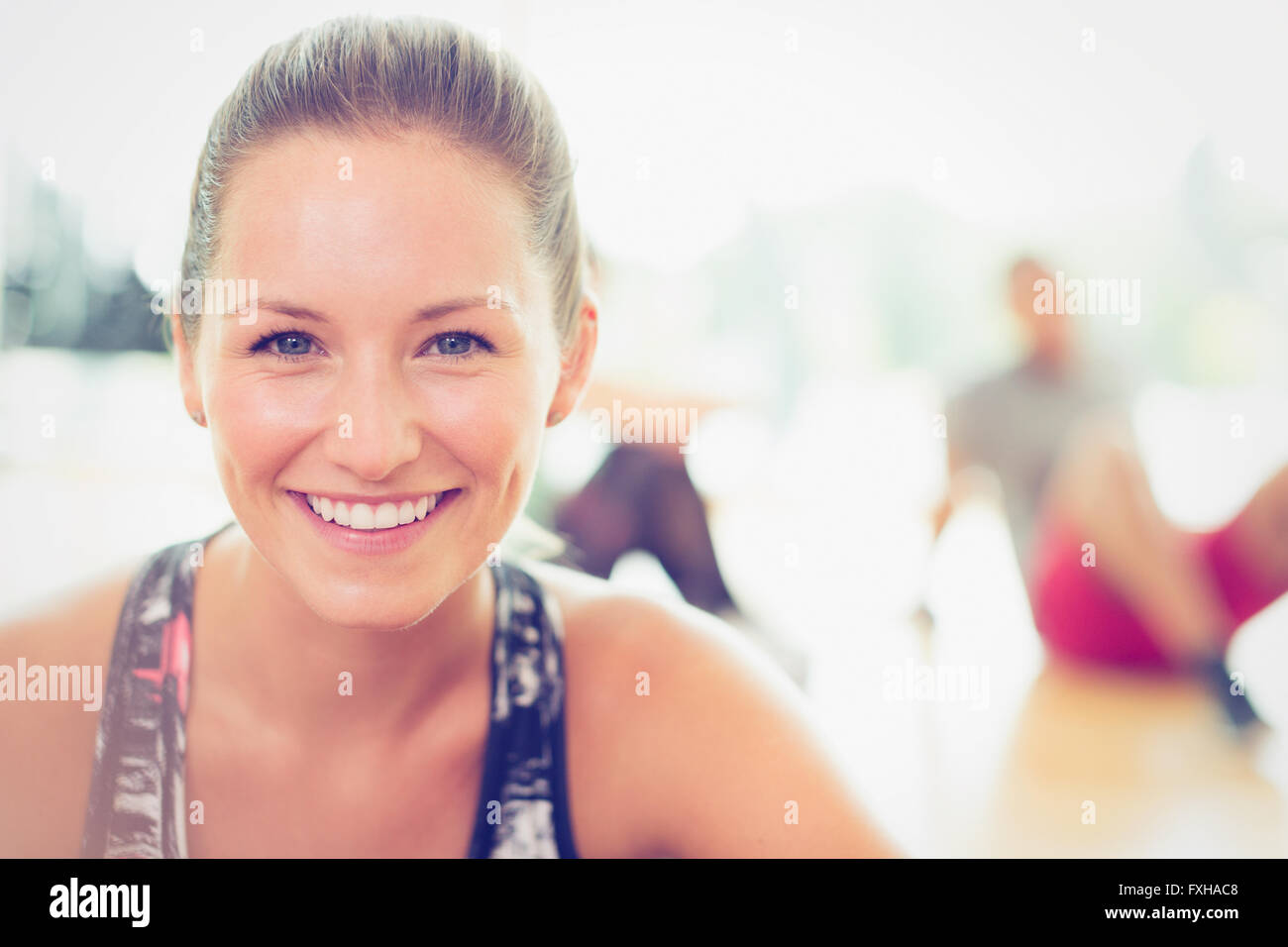 Close up portrait smiling woman in exercise class Stock Photo
