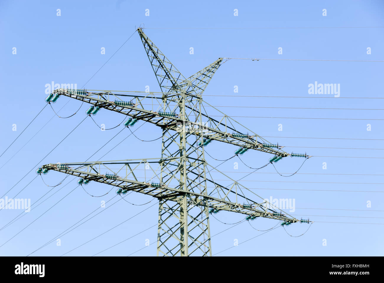 Tension tower with traverses of a high-voltage line Stock Photo