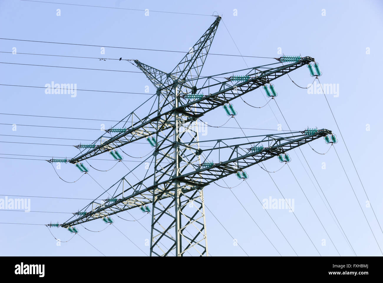 Tension tower with traverses of a high-voltage line Stock Photo