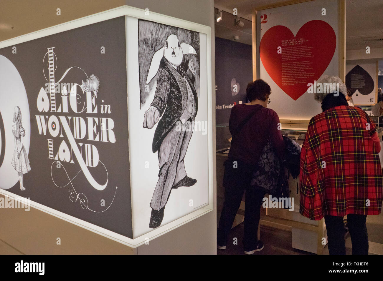 Visitors view the Alice in Wonderland exhibition at the British Library ...