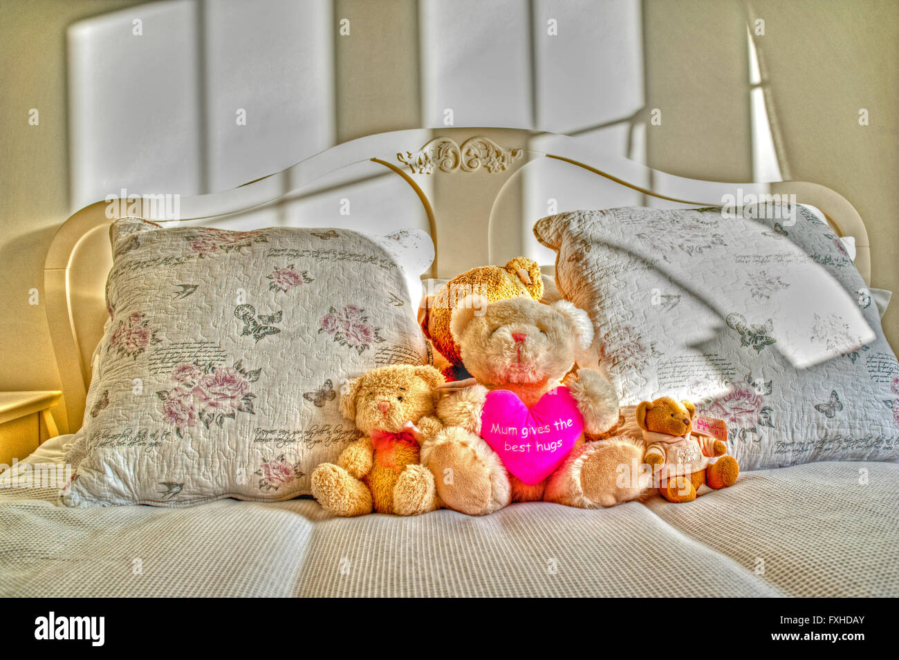 Teddy Bears on a Bed Stock Photo - Alamy