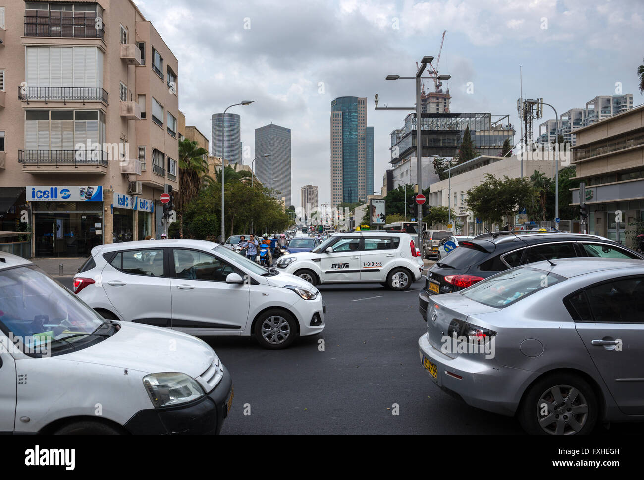 Eliezer Kaplan and Ibn Gabirol Streets in Tel Aviv, Israel. Azrieli Center Towers (left) and Kirya Tower (right) on background Stock Photo