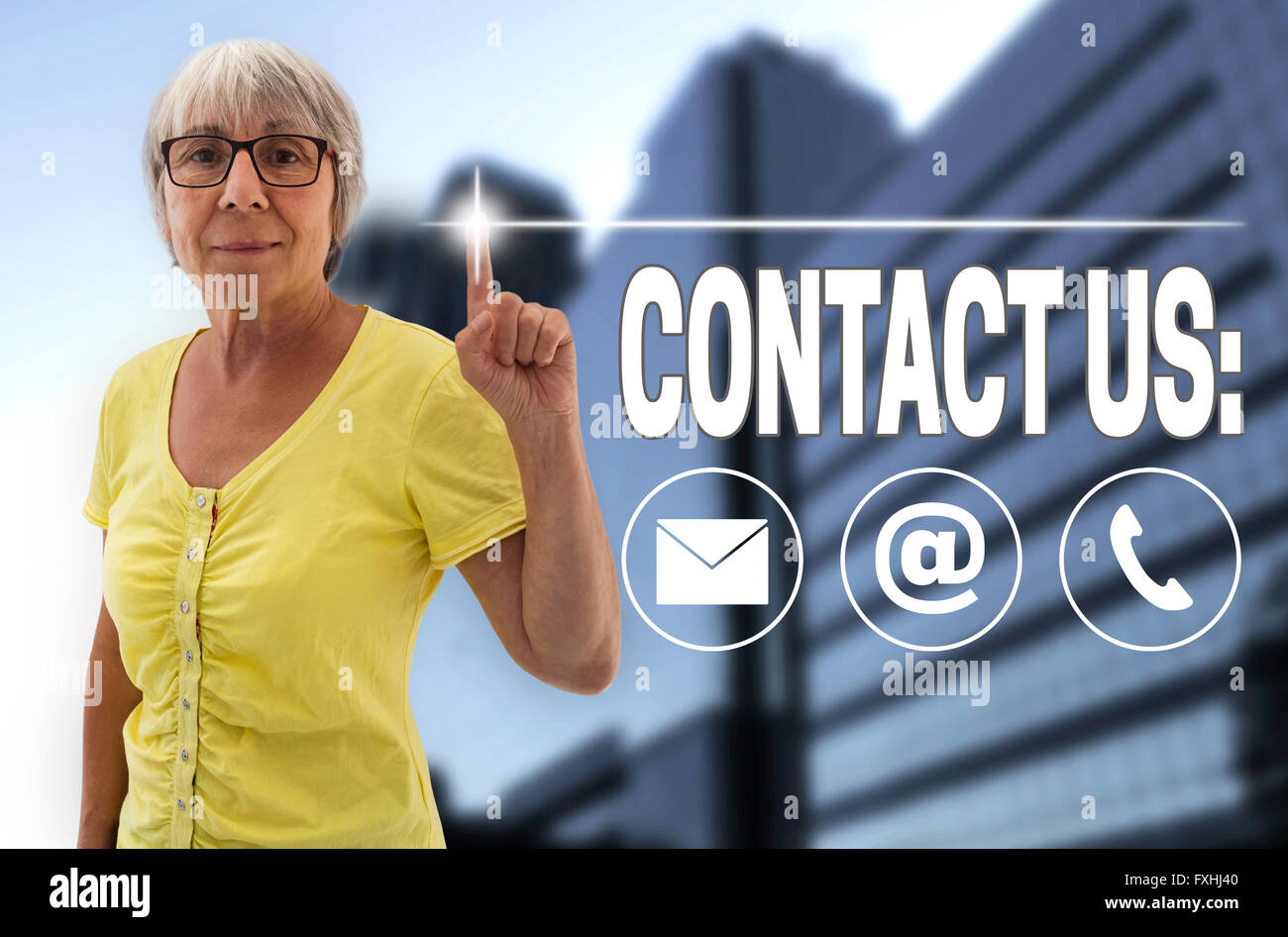 contact us touchscreen is shown by senior women. Stock Photo