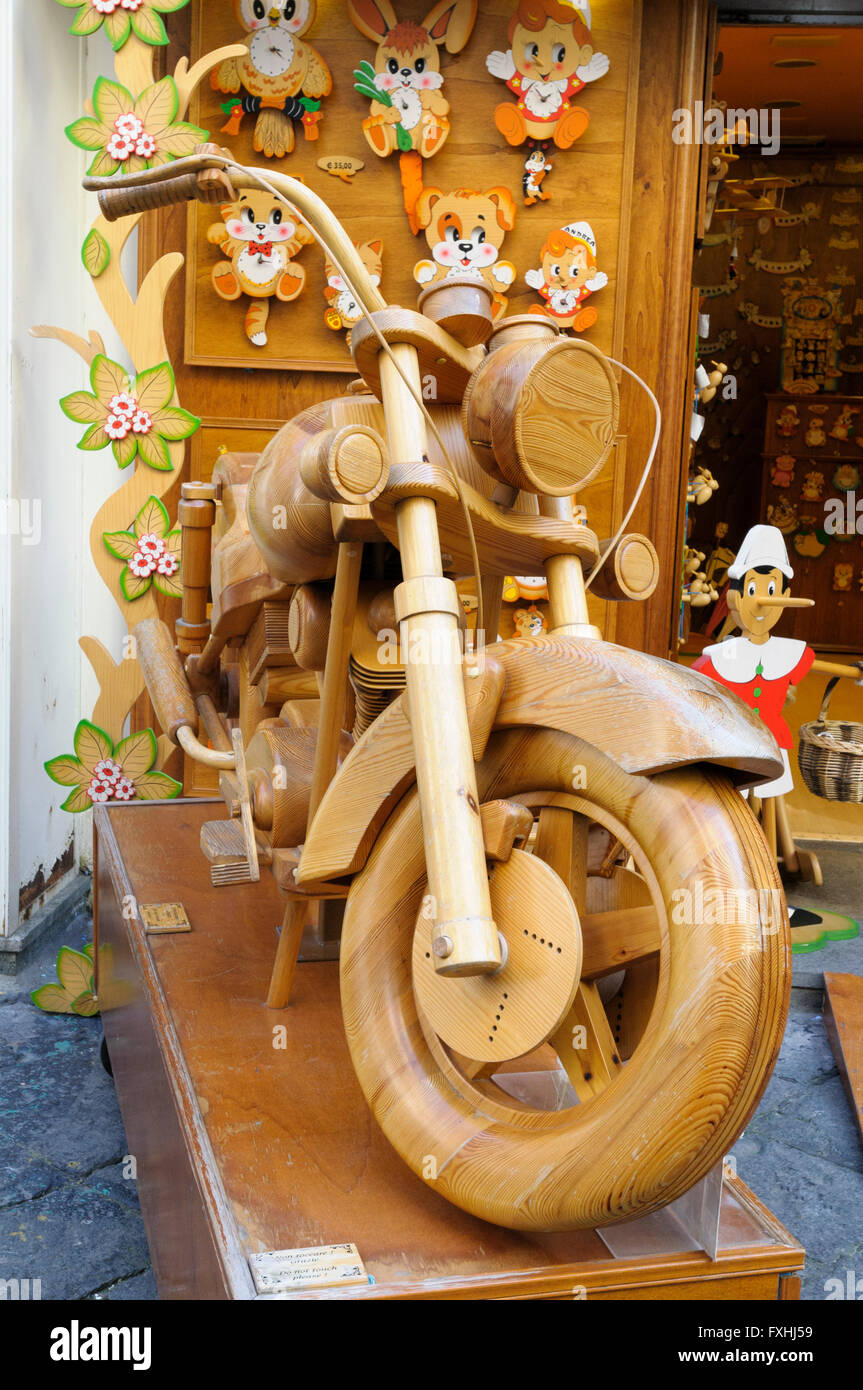 Full-size wooden model of a motorbike displayed outside a shop in Sorrento, Italy Stock Photo