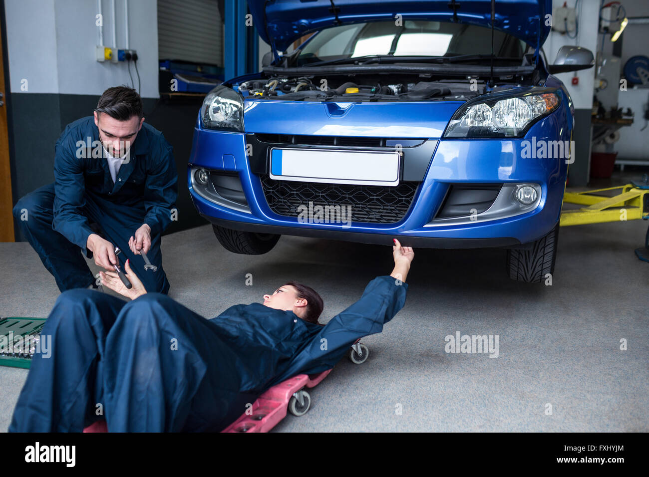 Mechanics repairing a car Stock Photo