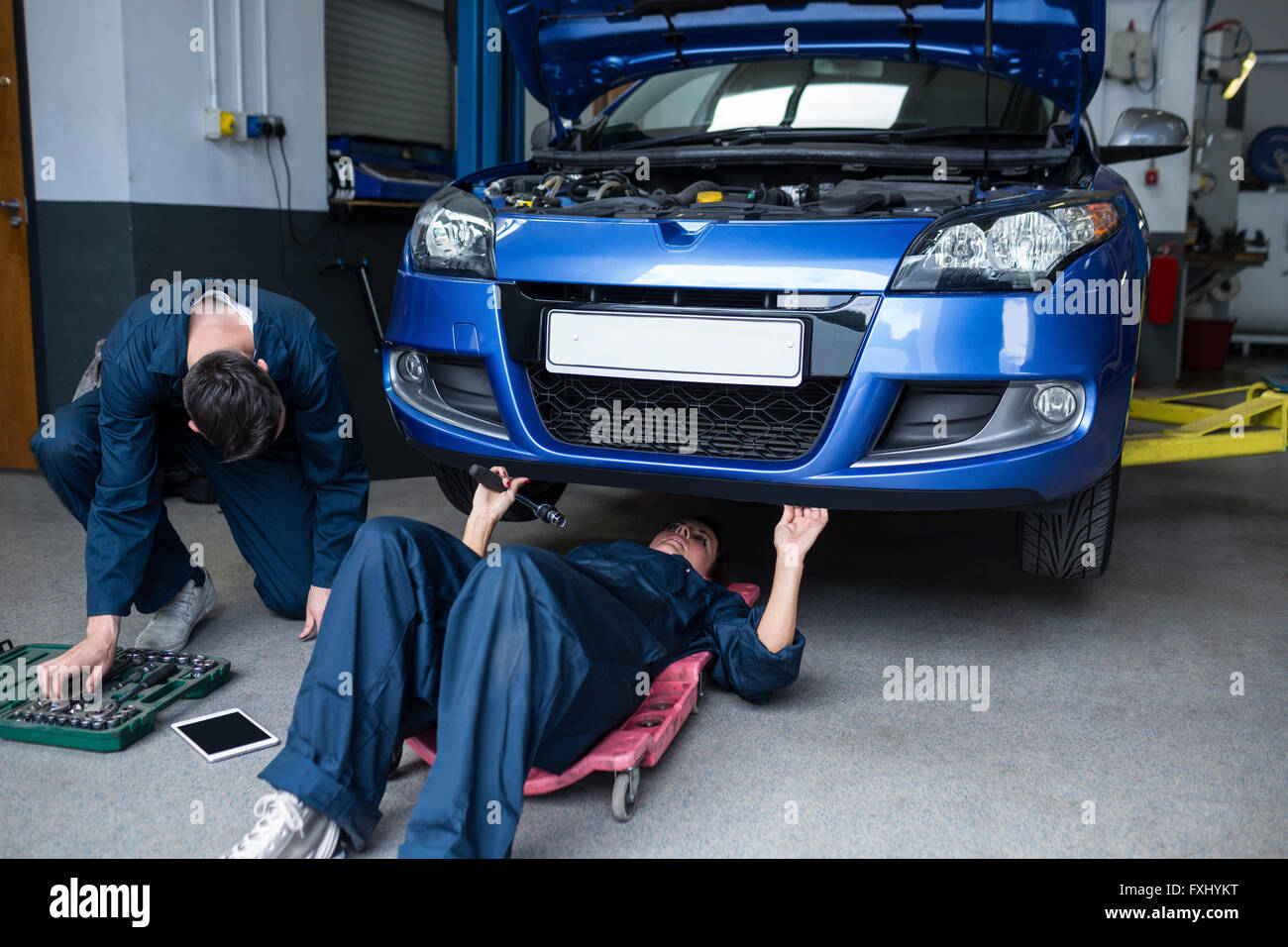 Mechanics repairing a car Stock Photo Alamy