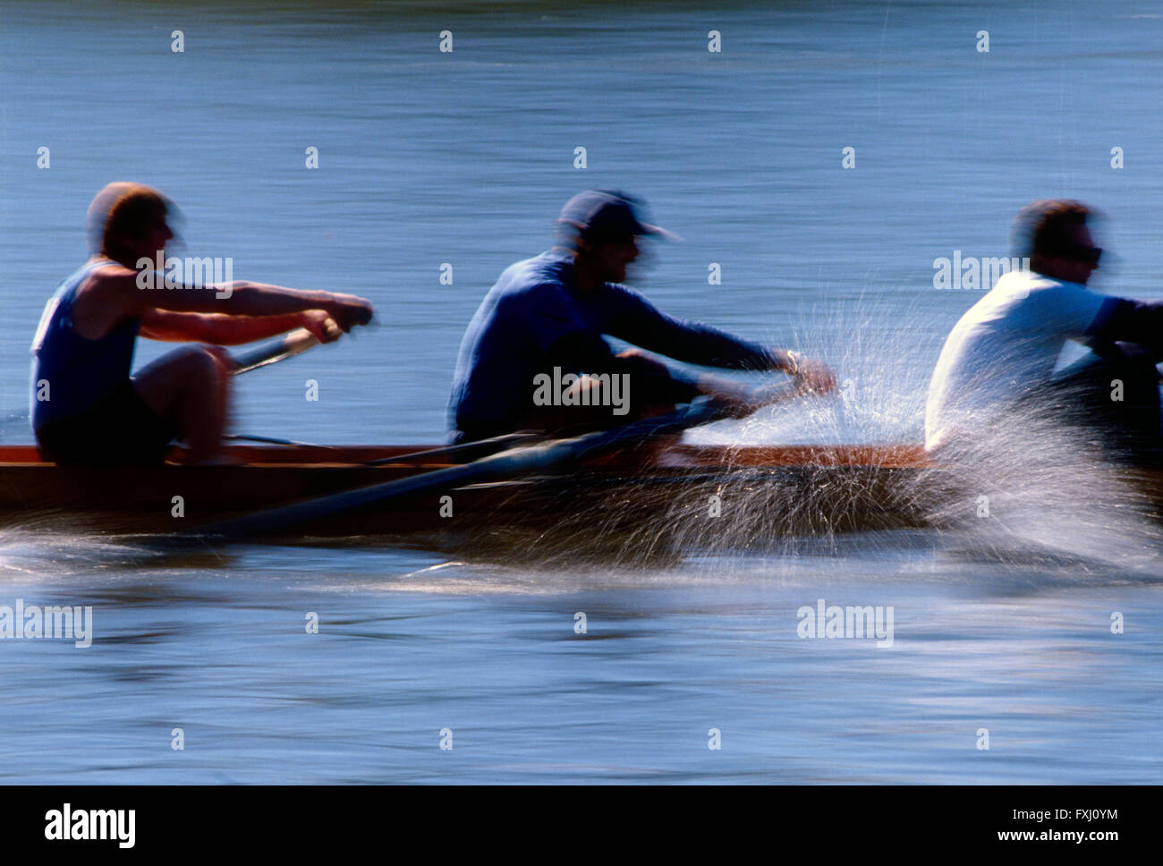 Motion blur pan view of scullers rowing in the Head of the Schuylkill Regatta; Schuykill River; Philadelphia; Pennsylvania; USA Stock Photo