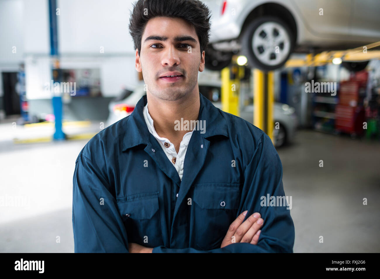 Mechanic with arms crossed Stock Photo Alamy