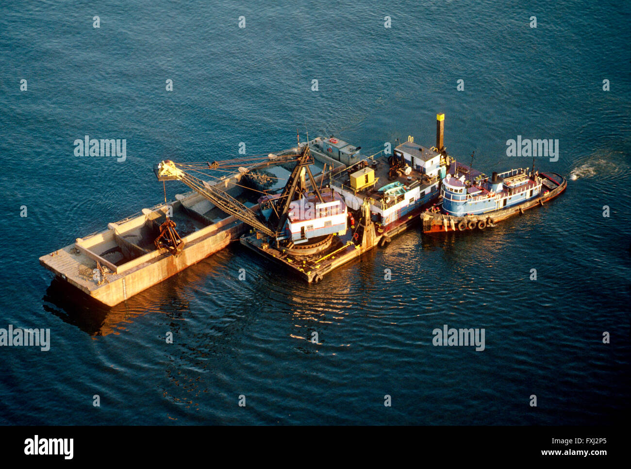 Aerial view of tugboat & dredge barge in Delaware River near Philadelphia; Pennsylvania: USA Stock Photo