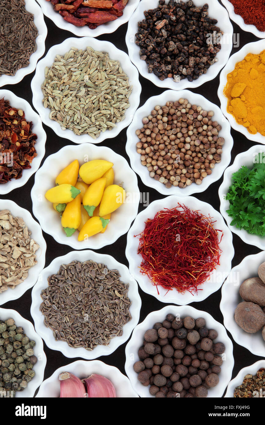 Herb and spice selection in porcelain crinkle bowls Stock Photo Alamy