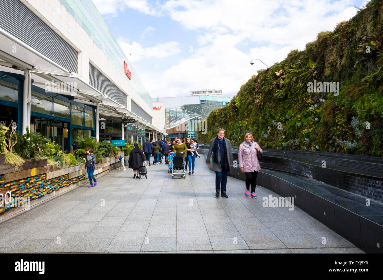 Looking along a pedestrian walkway at Westfield Shopping Centre in Shepherds Bush London. Stock Photo