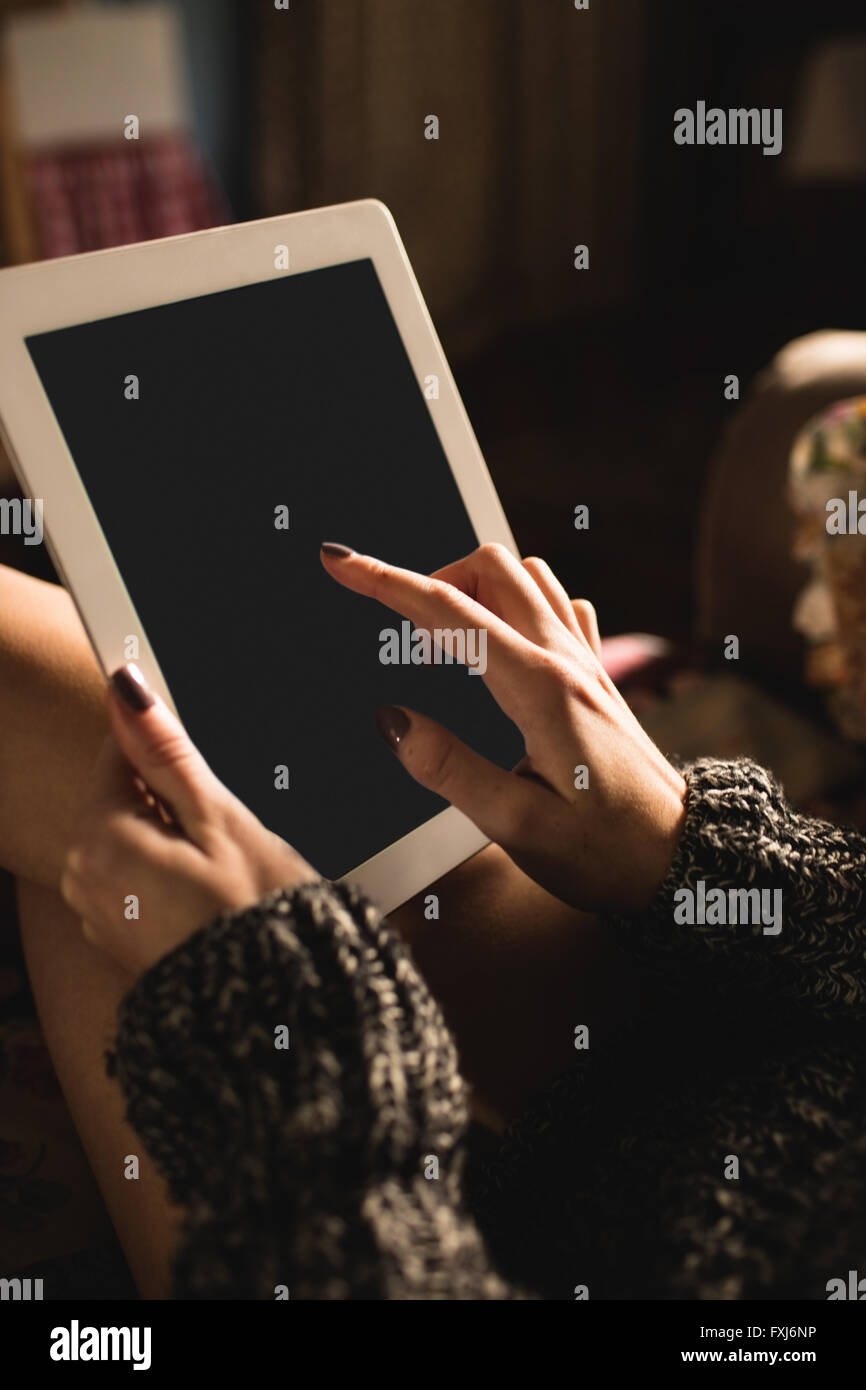 Woman using digital tablet Stock Photo - Alamy