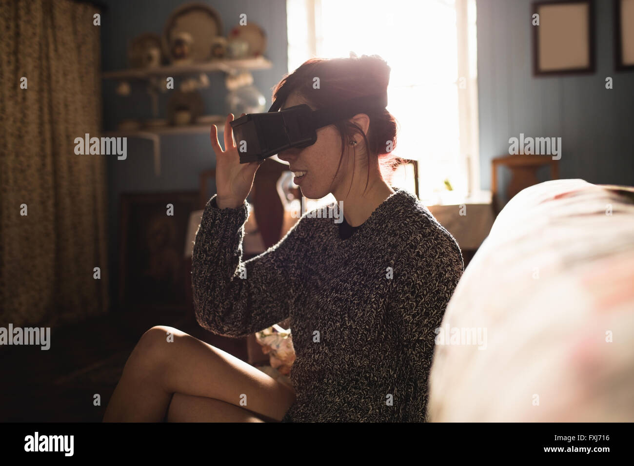 Young woman using the virtual reality headset Stock Photo - Alamy