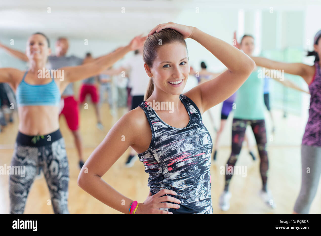Portrait smiling woman in exercise class Stock Photo