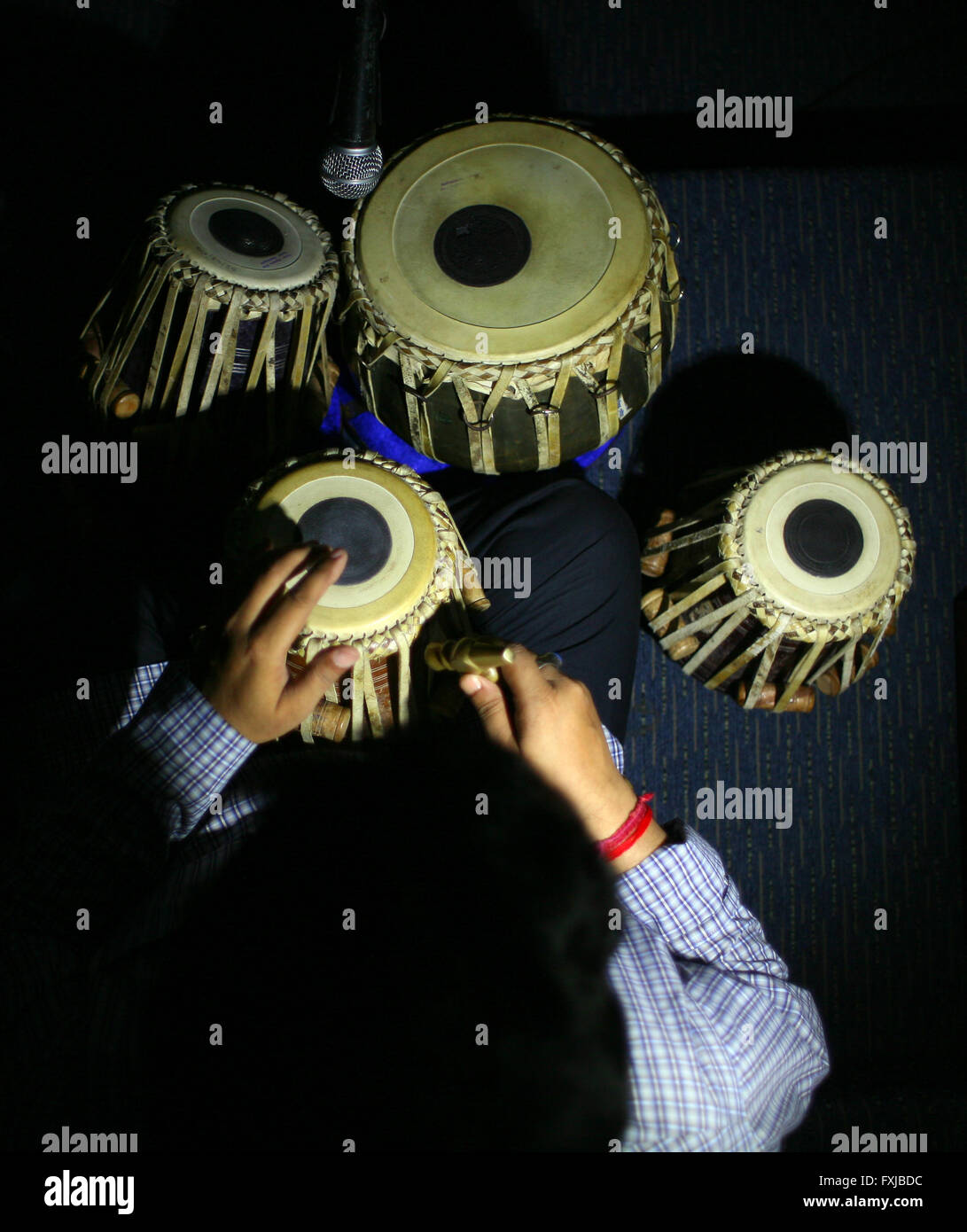 Man tuning on traditional Indian tabla drums Stock Photo Alamy