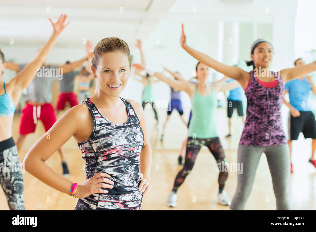 Portrait smiling woman in exercise class Stock Photo