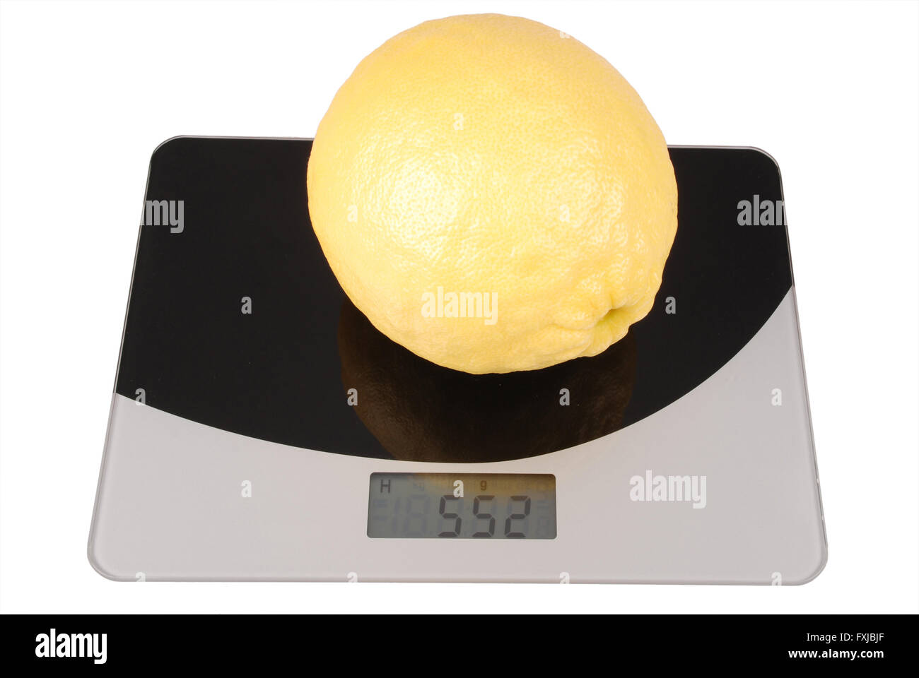 Kitchen scale with giant lemon isolated on white Stock Photo