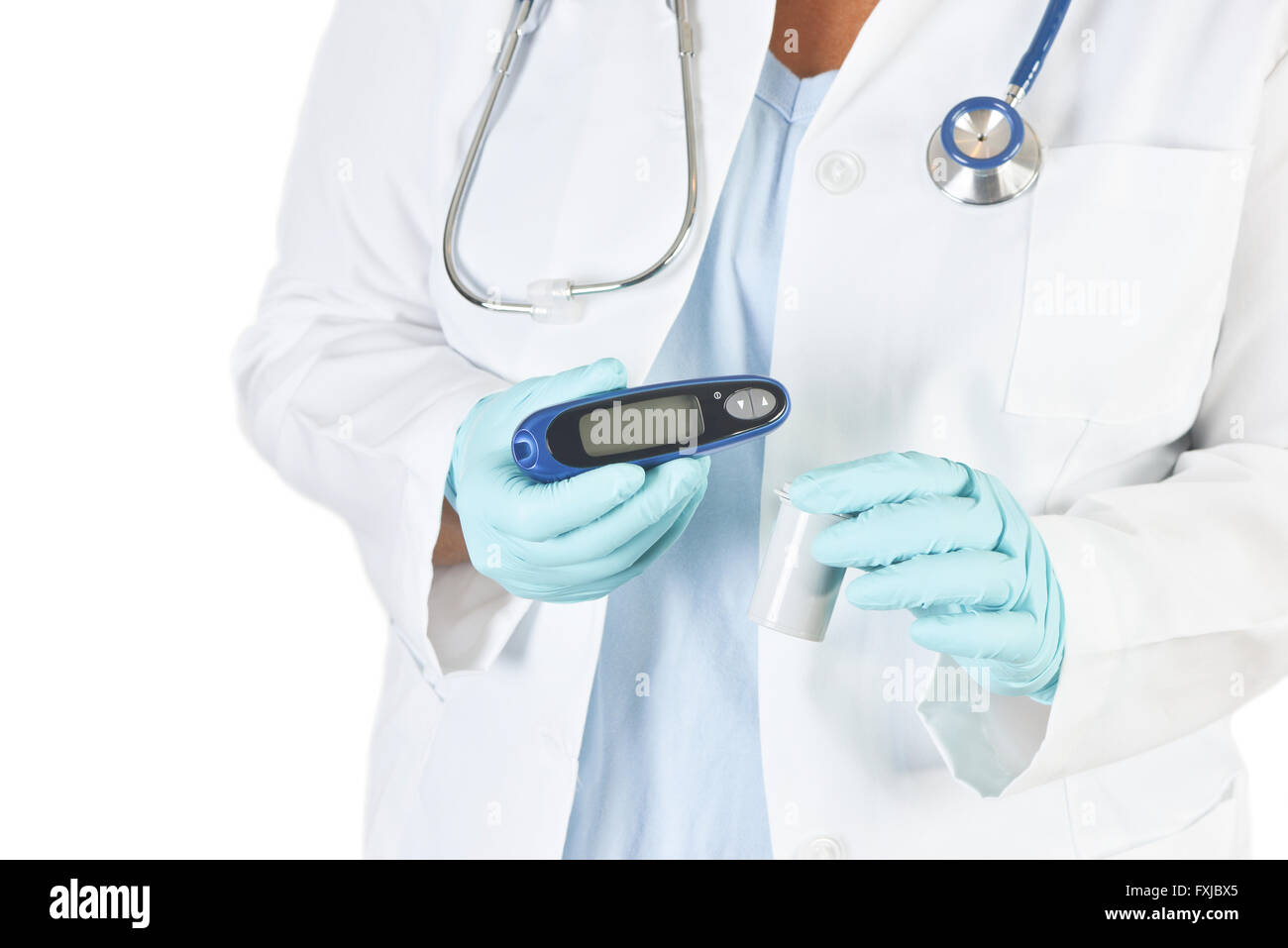 Doctor holds diabetic testing strips and glucometer. Stock Photo