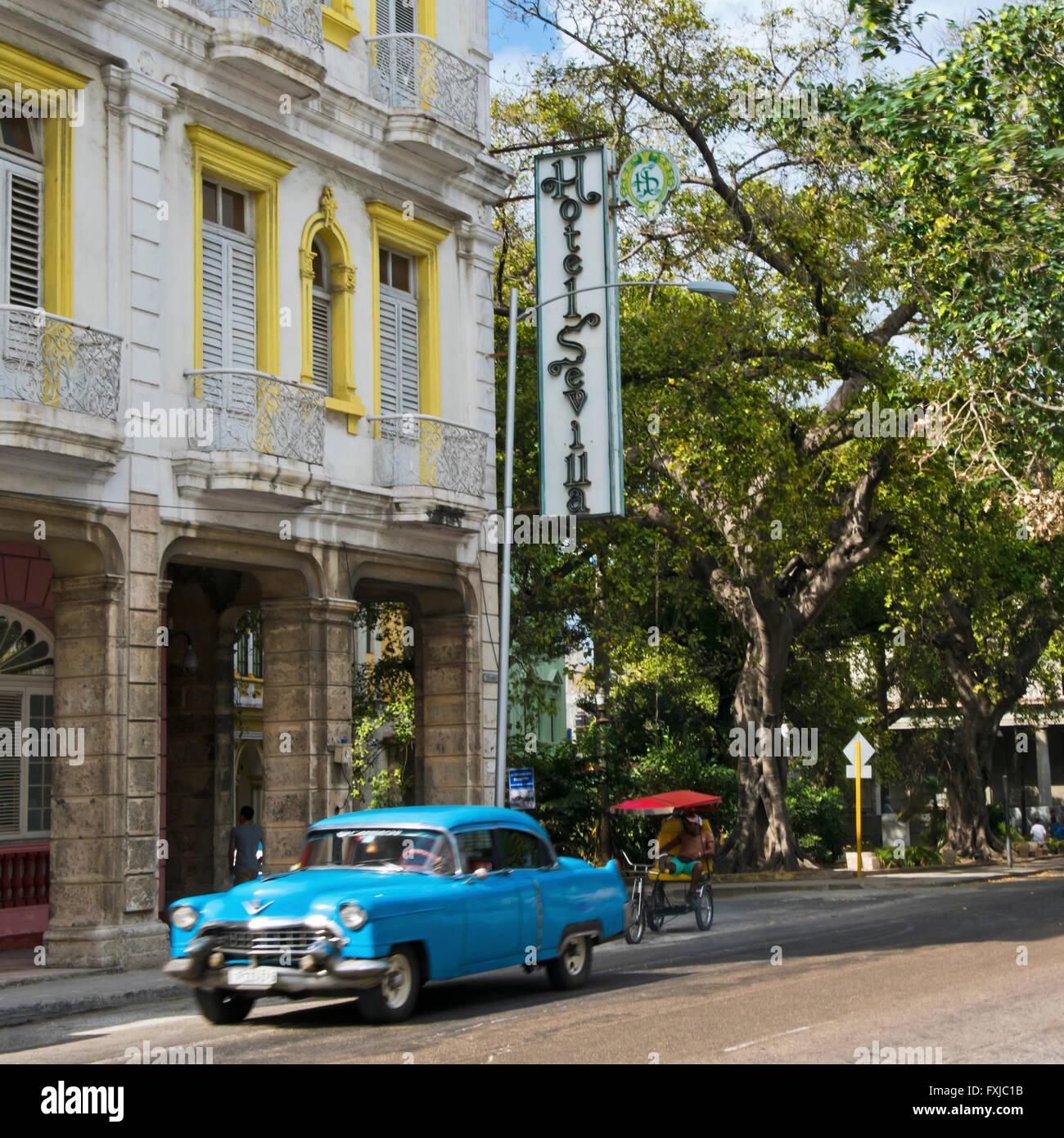 Square view of a vintage American car driving by Hotel Sevilla in Havana, Cuba. Stock Photo