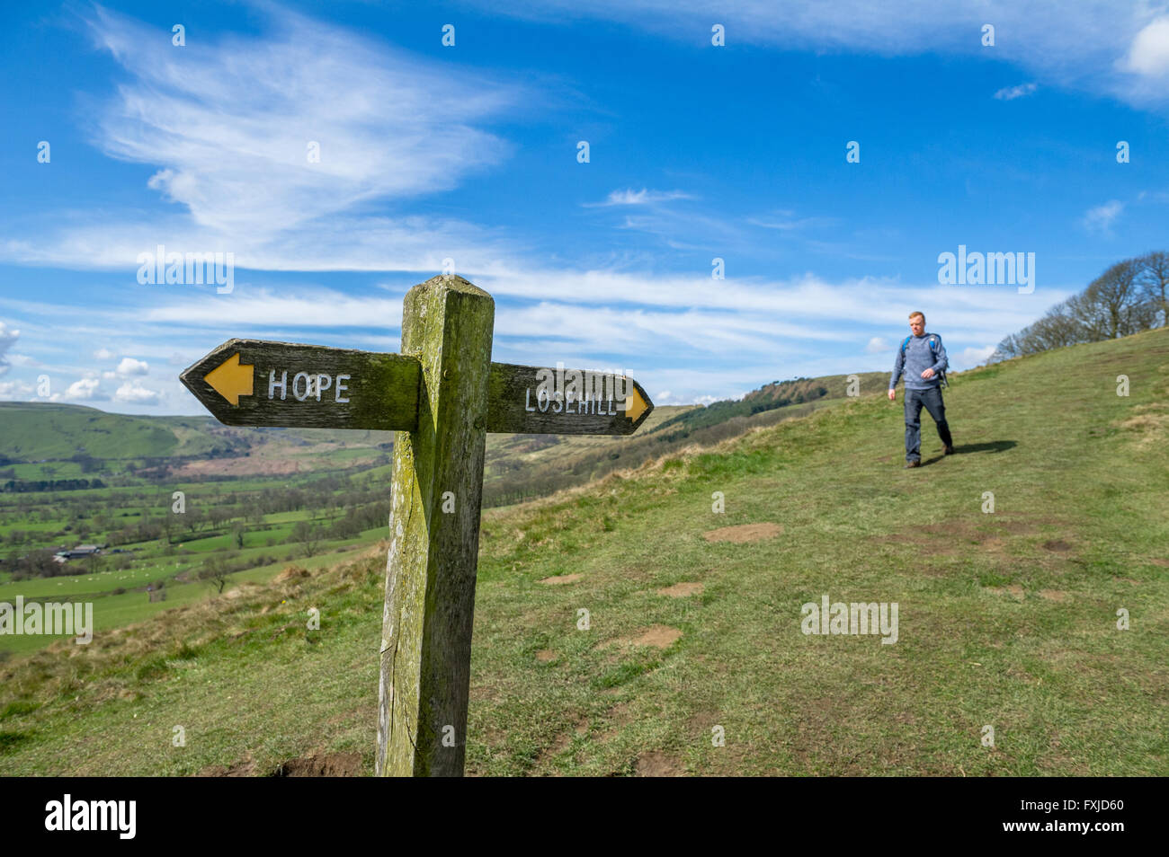 Wooden sign post showing directions to Hope and Lose Hill, part of the