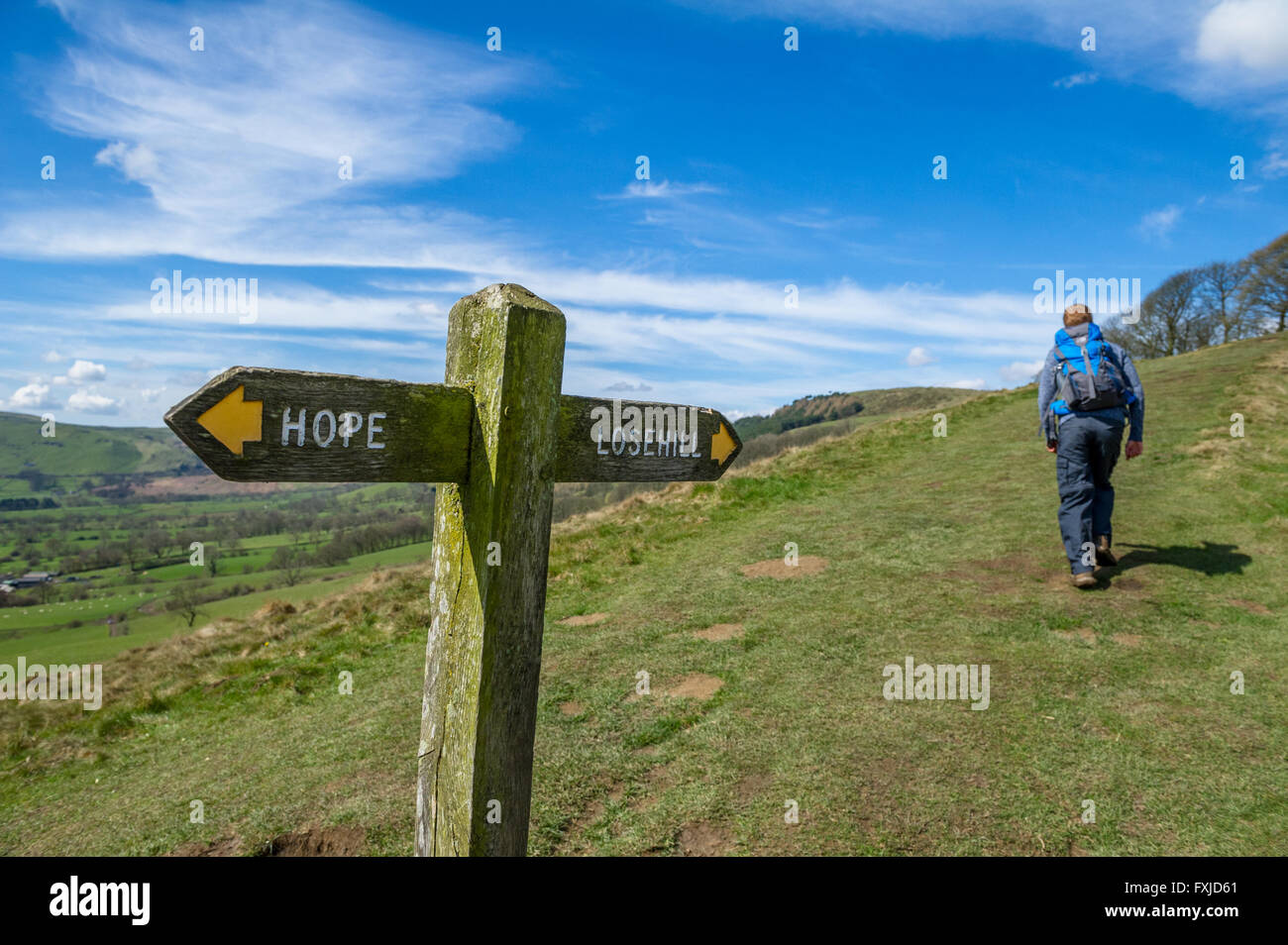 Wooden sign post showing directions to Hope and Lose Hill, part of the