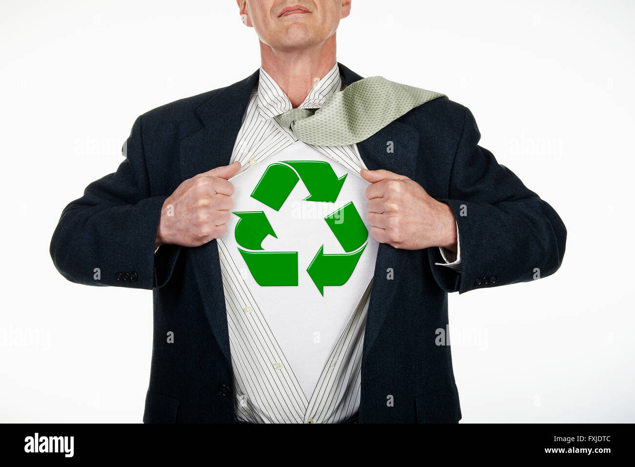 Superhero pulling Open White Shirt with recycling symbol on white background Stock Photo