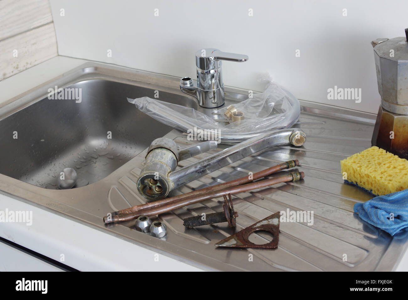 Replacing A Kitchen Tap Stock Photo Alamy