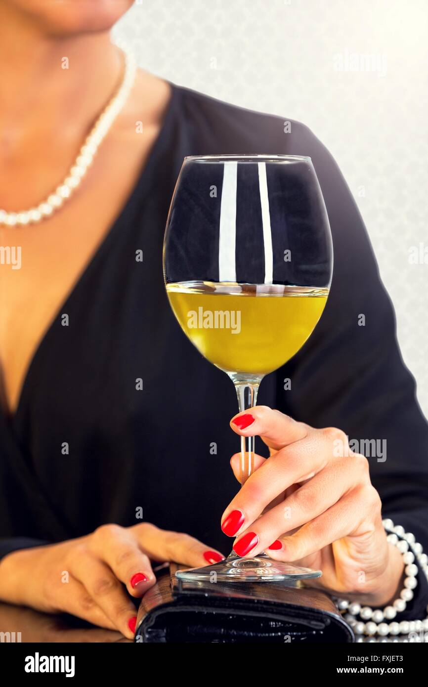 Elegant young female,drinking wine. Stock Photo