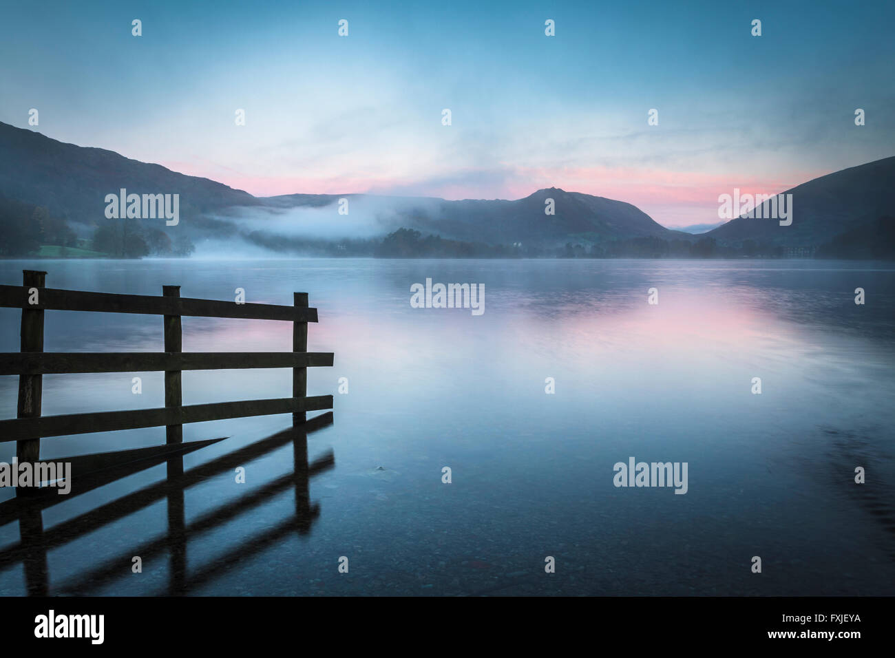 Grasmere Lake at Sunrise, Grasmere, Lake District, Cumbria, England UK Stock Photo