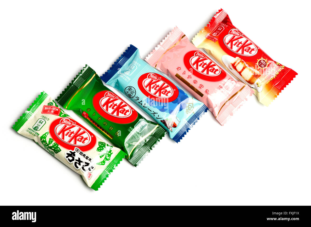 Variety of KitKat flavours from Japan. (wasabi, matcha (green tea), rum and raisin, raspberry and strawberry cheesecake) Stock Photo