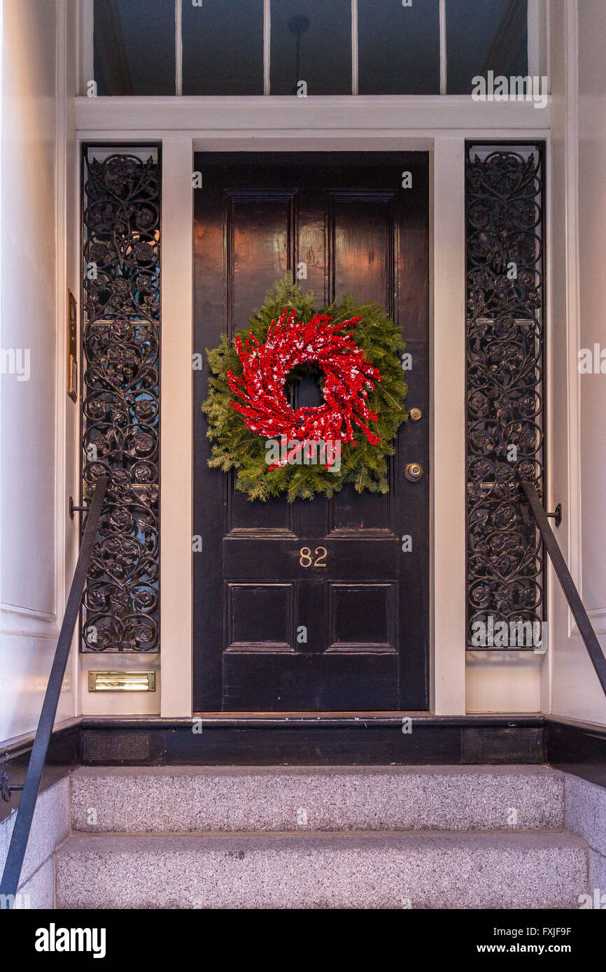 A Christmas wreath on a front door on a house in Beacon Hill  Beacon Hill , Boston, Massachusetts, USA Stock Photo
