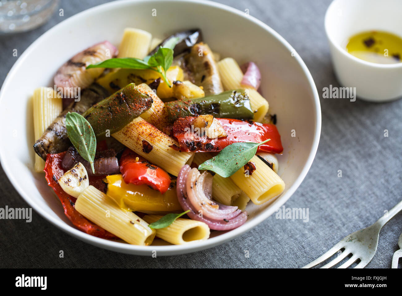Rigatoni with roasted ,aubergine,bell pepper and garlic Stock Photo