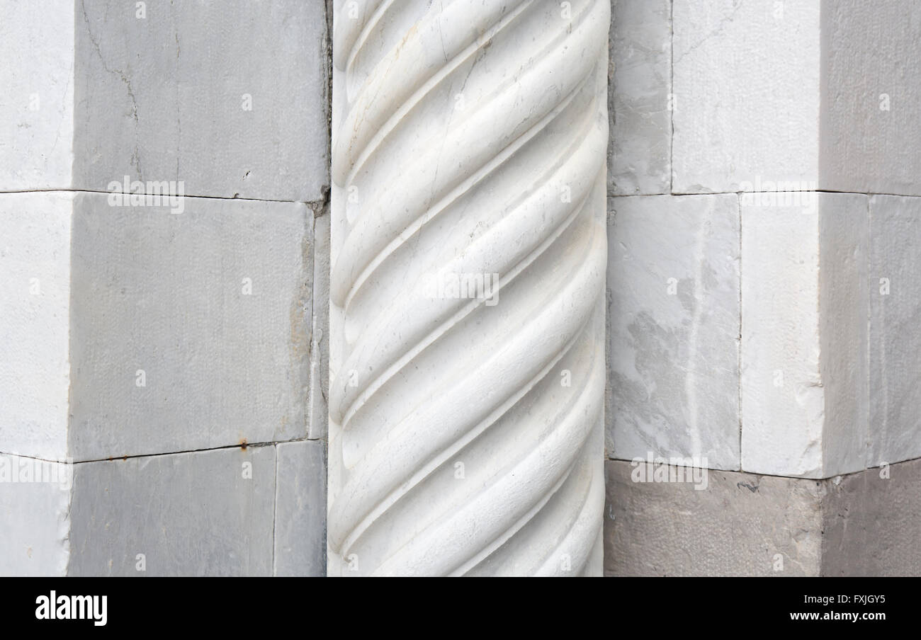 Marble column of the Lucca cathedral named Saint Martin Stock Photo